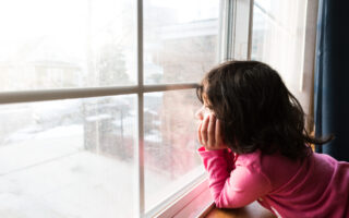 little girl looking out the window